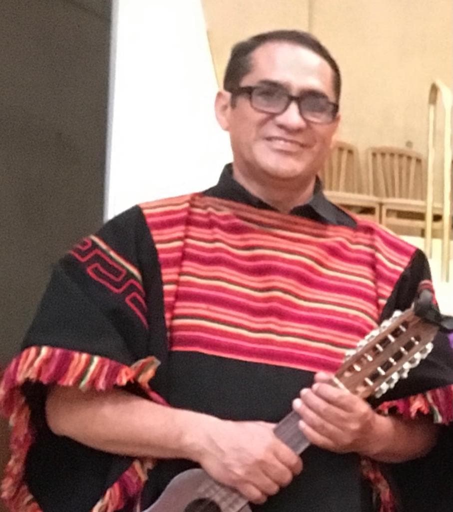 Edwin Ramos holding a charango